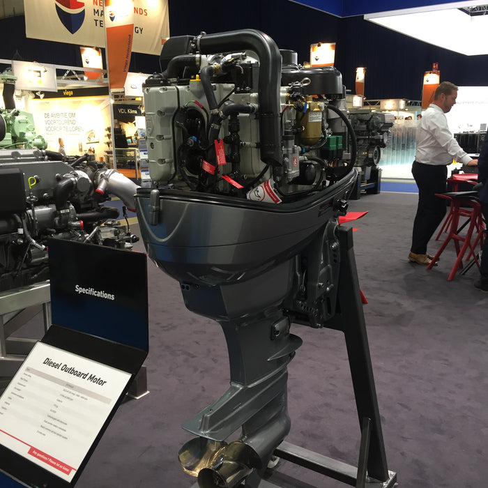 Outboard motor with the cowling removed, showing the engine block, wiring, and internal components